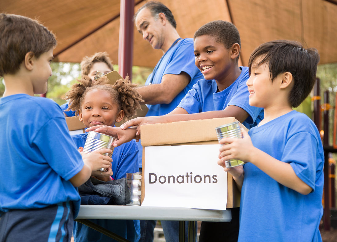 Charity volunteers holding a donation box